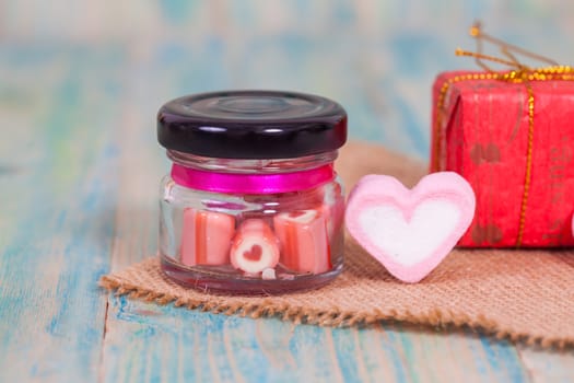 candies sweets heart in bottle on table