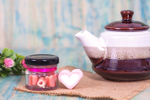 candies sweets heart in bottle on table
