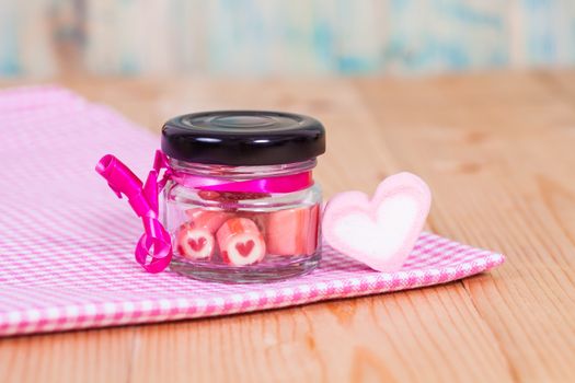 candies sweets heart in bottle on table