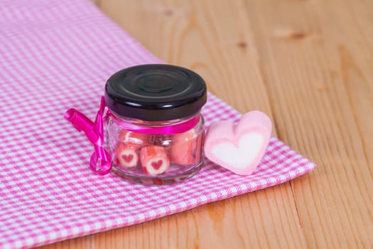 candies sweets heart in bottle on table
