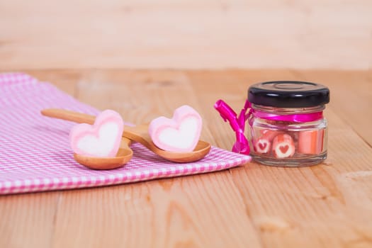 candies sweets heart in bottle on table
