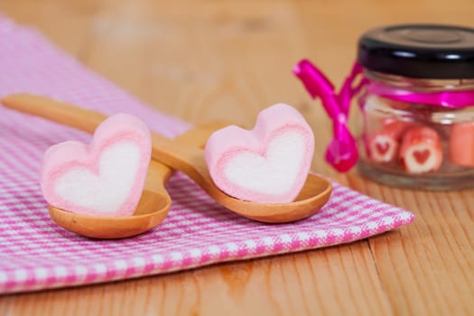 candies sweets heart in bottle on table