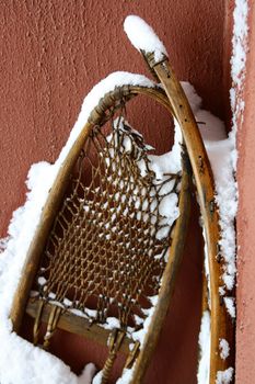 old snowshoe with snow on it 