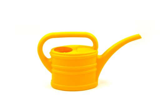 Yellow watering can isolated on a white background, closeup