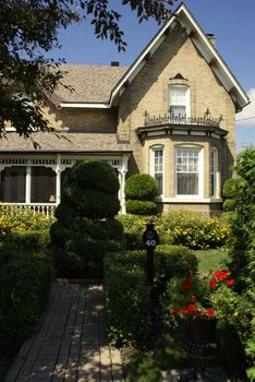 An exterior of a beautifully designed home and garden.