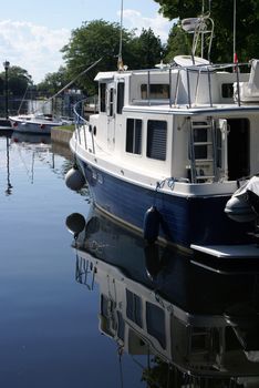 A closeup view of this large motorboat on a waterway.