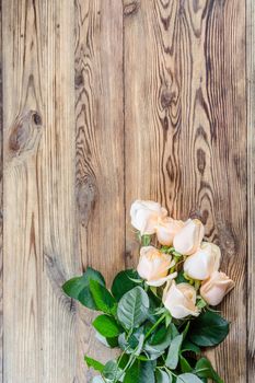 Roses on rustic wooden table