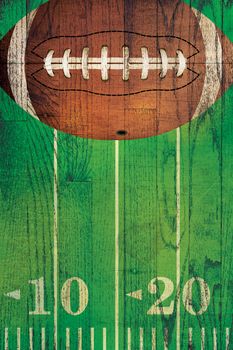An American football and field painted over a textured hardwood floor background.