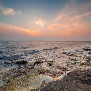 Seascape with beautiful beach and sunset