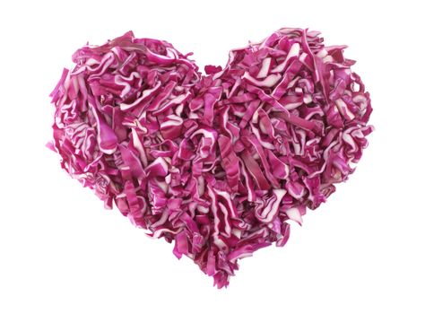 Shredded raw red cabbage in a heart shape, isolated on a white background