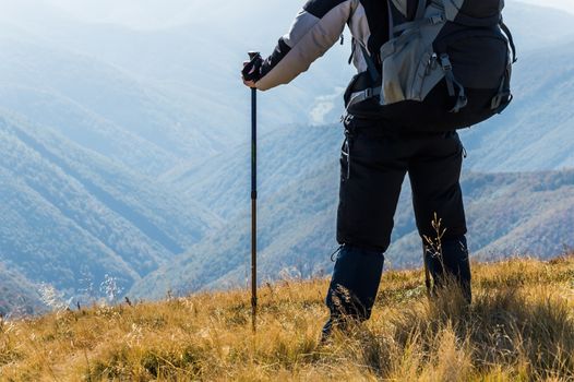 Traveler in the mountains looks away