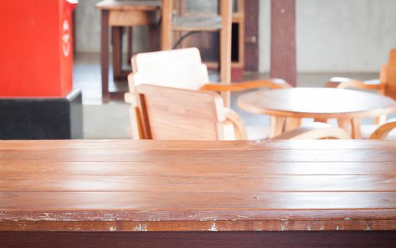 Empty wooden table in coffee shop, stock photo
