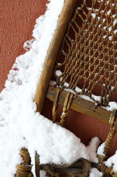 old snowshoe with snow on it 