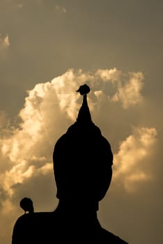 Backlight silhouette of Buddha statues in the temple