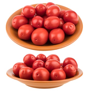 Fresh tomatoes on plate. Isolated on white background. Selective focus.