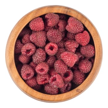 Raspberries in a wooden bowl on white background. top view.