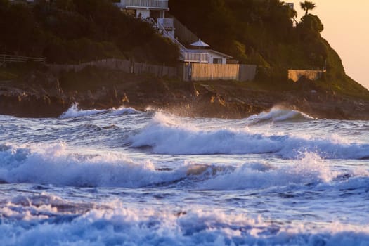 Colorful ocean waves at sunset in Chile