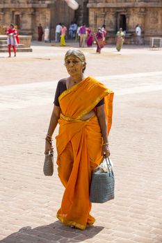 Thanjavur, Tamil Nadu, India - June 27, 2014. Tanjore temple in Tamil Nadu India Unesco building. Religious people around the temple.