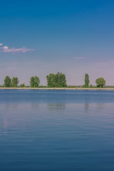 Relaxing water landscape with tree reflections