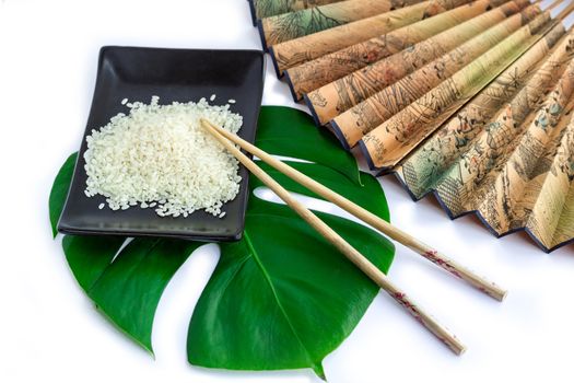 Oriental set of rice, chopsticks, green leaf and transp  isolated on white background