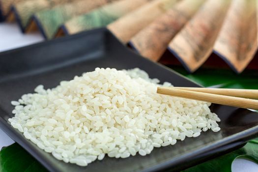 Oriental set of rice, chopsticks and transp