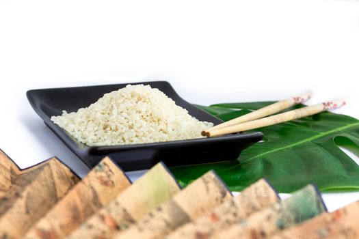 Oriental set of rice, chopsticks, green leaf and transp  isolated on white background