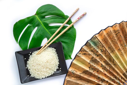 Oriental set of rice, chopsticks, green leaf and transp  isolated on white background