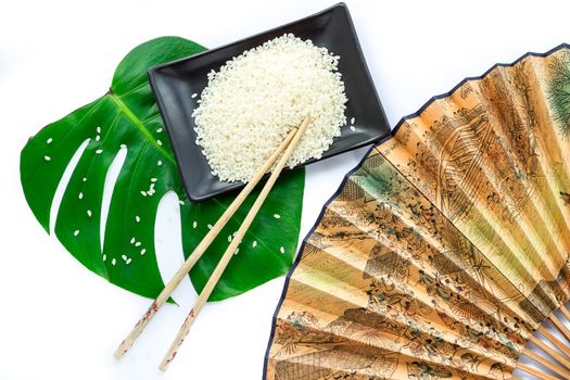 Oriental set of rice, chopsticks, green leaf and transp  isolated on white background