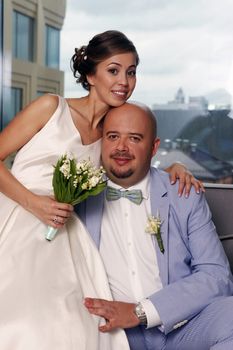 Charming bride and groom in their house