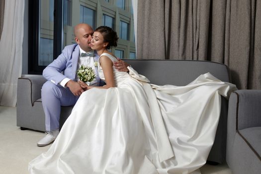 Charming bride and groom in their house