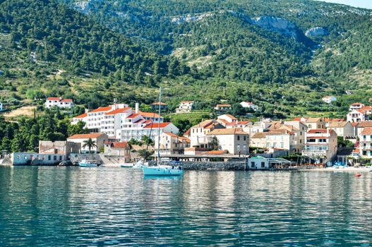 Small town bay with sail yachts