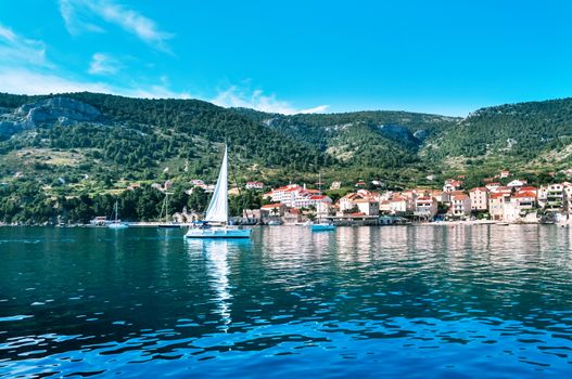 Small town marina bay with sail yachts