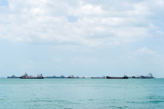 Container ship at anchor on the horizon