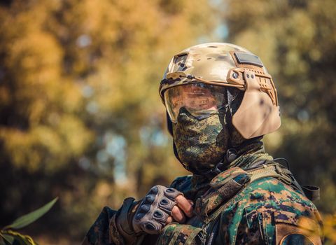 soldier in uniform with weapon on a mission