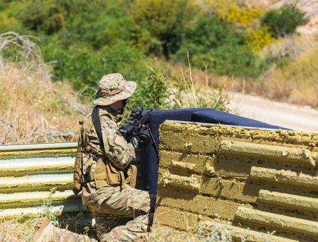 soldier in uniform with weapon on a mission