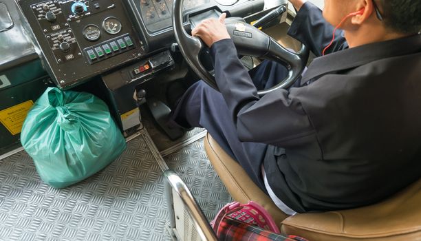 transport, transportation, tourism, road trip and people concept - close up of bus driver holding wheel driving passenger bus