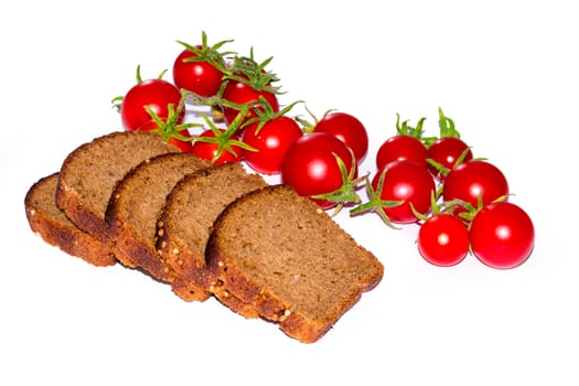 Composition of black bread slices and cherry tomatoes