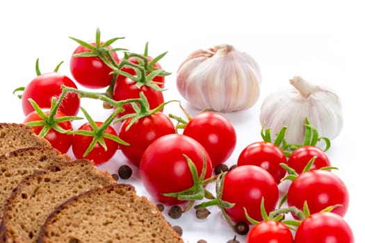 Composition of black bread,  tomatoes and garlic