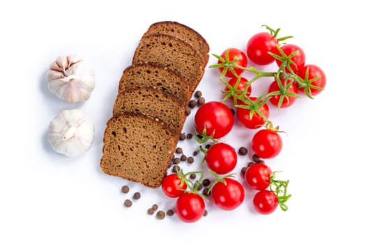 Set of bread slices, bunch of cherry tomatoes and garlic