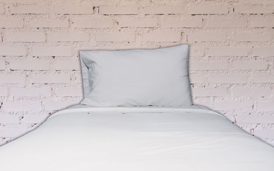 Single bed with white brick wall decorated in coffee shop