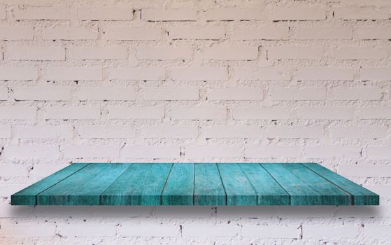 Top of blue wooden shelf with white brick wall decorated in coffee shop