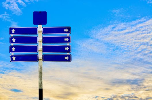 Road Sign on blue sky background