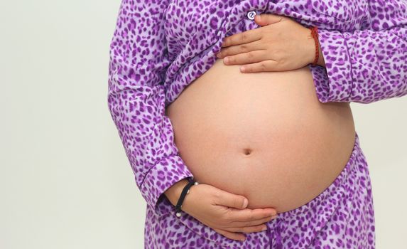 Photo of a cute pregnant woman belly