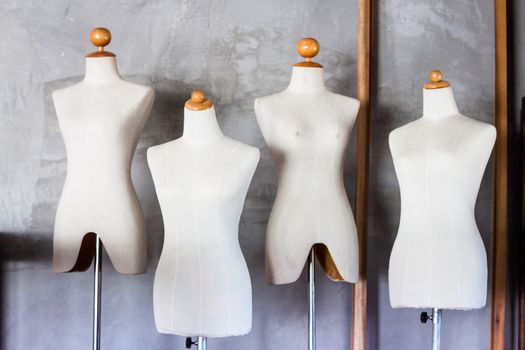 Mannequin tailors in storage room with vintage filter, stock photo