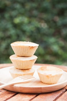 Mini pies on wooden plate, stock photo