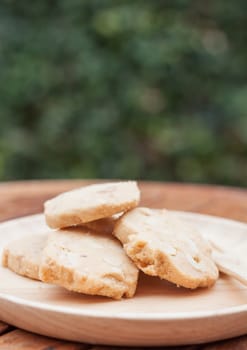 Cashew cookies on wooden plate, stock photo