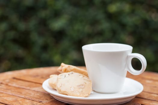 Cashew cookies with coffee cup, stock photo