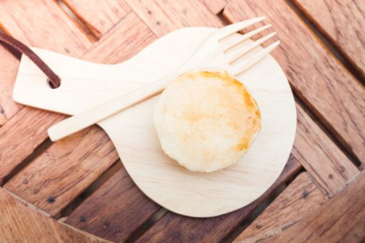 Mini pies on wooden plate, stock photo