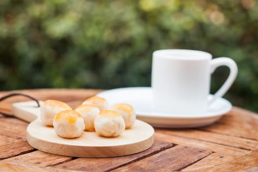 Mini Chinese cakes on wooden plate, stock photo
