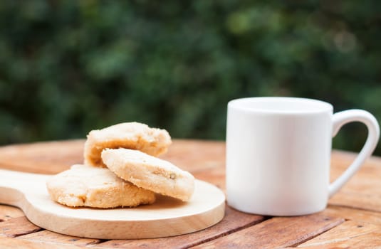 Cashew cookies with coffee cup, stock photo